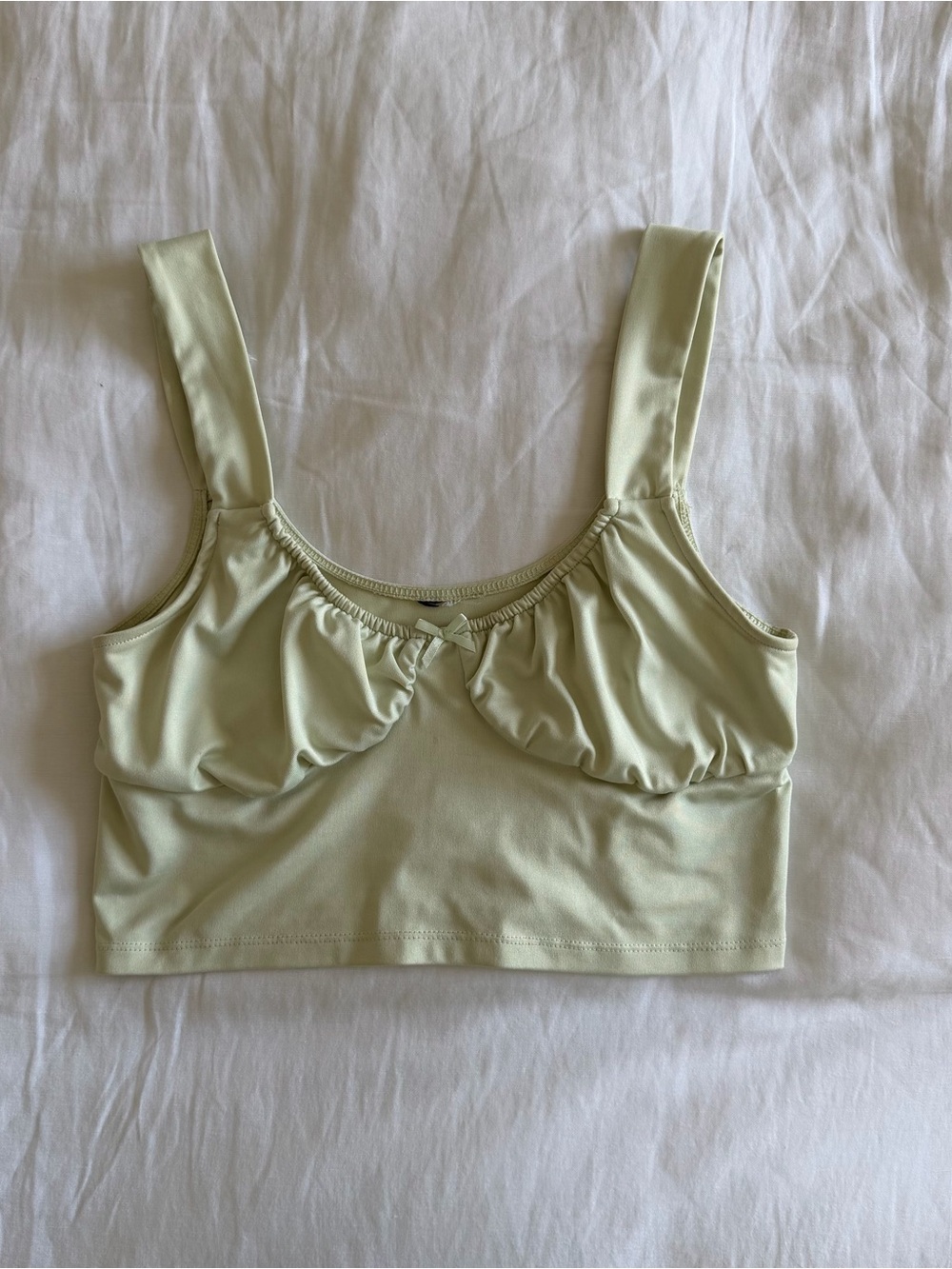 Light green crop top with bow detail